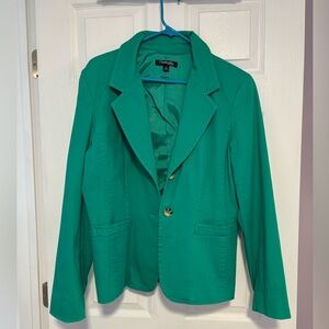 Green blazer with brown button detail on sleeves